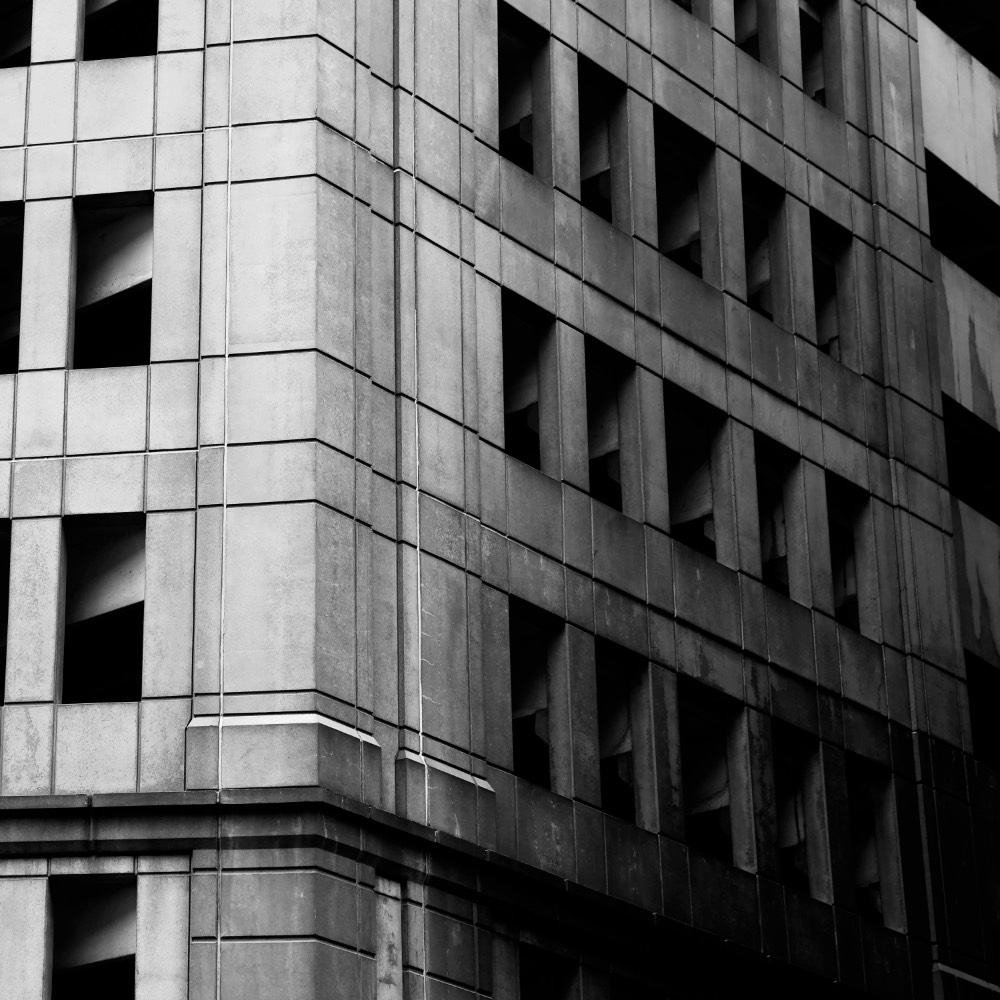 B&W photo of a corner of an office building